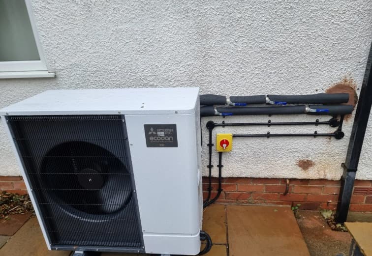 Air source heat pump installation on a post-war house in Coventry