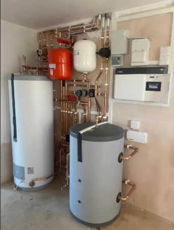 Heat pump cylinders, expansion vessels and copper pipework on a 4-bed detached house in Sutton Coldfield