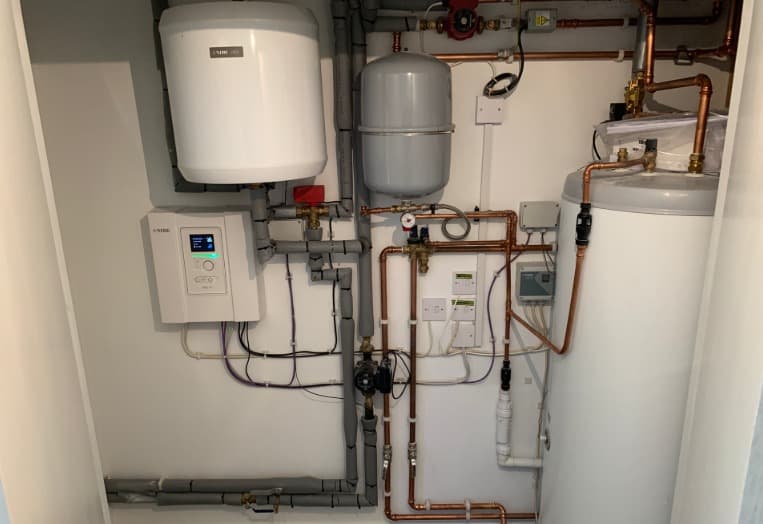 Indoor ground source heat pump cylinder, pumps and pipework